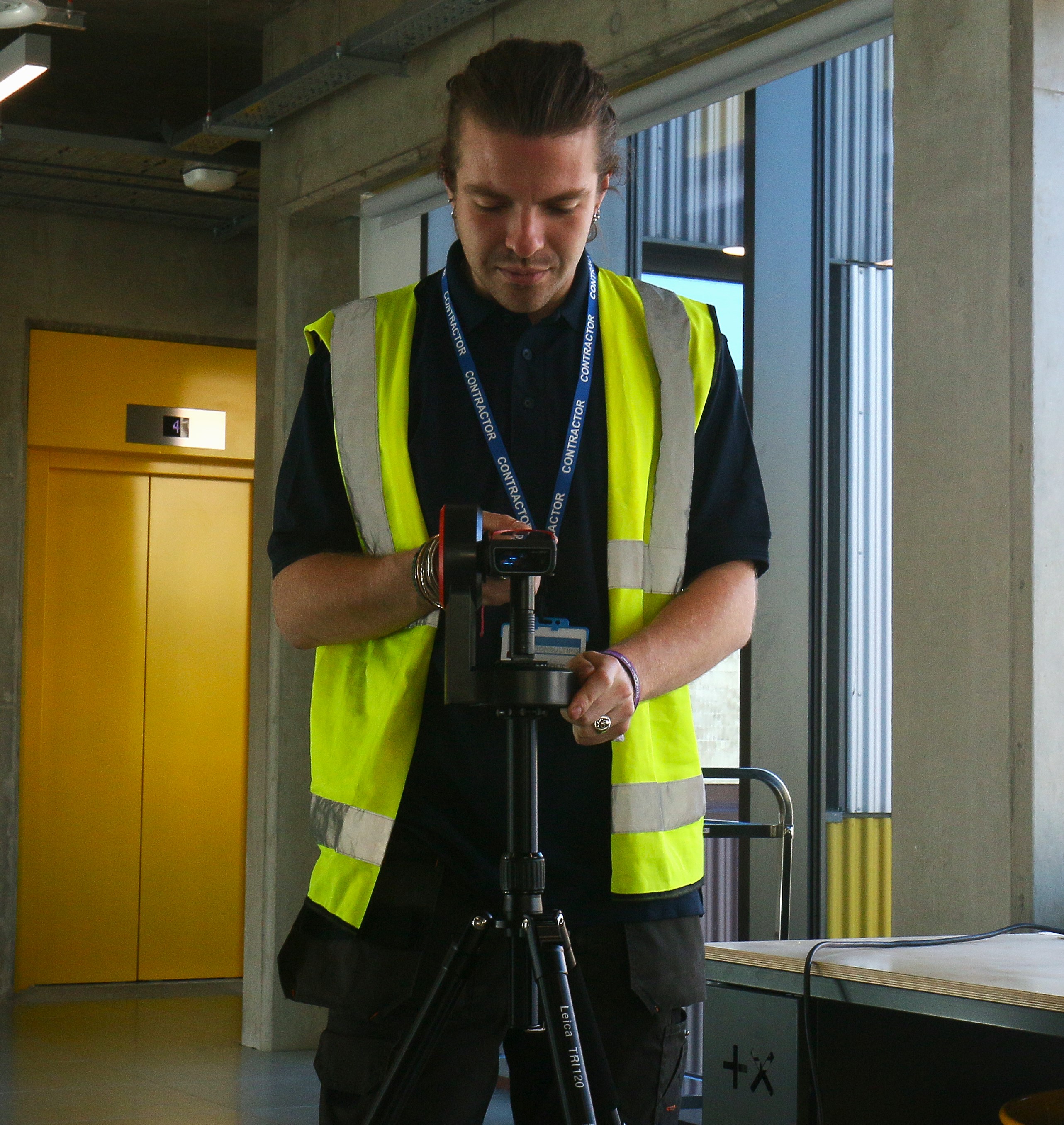 James using a lazer measuring tool